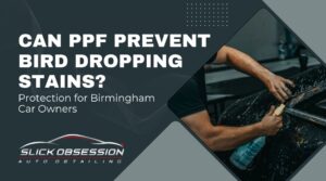 Promotional graphic asking "Can PPF Prevent Bird Dropping Stains?" with a subheading about protection for Birmingham car owners. Includes an image of a person applying a cleaning solution to a black car’s surface, emphasizing professional detailing work. Designed to highlight how PPF can help Birmingham drivers protect their paint from bird droppings.